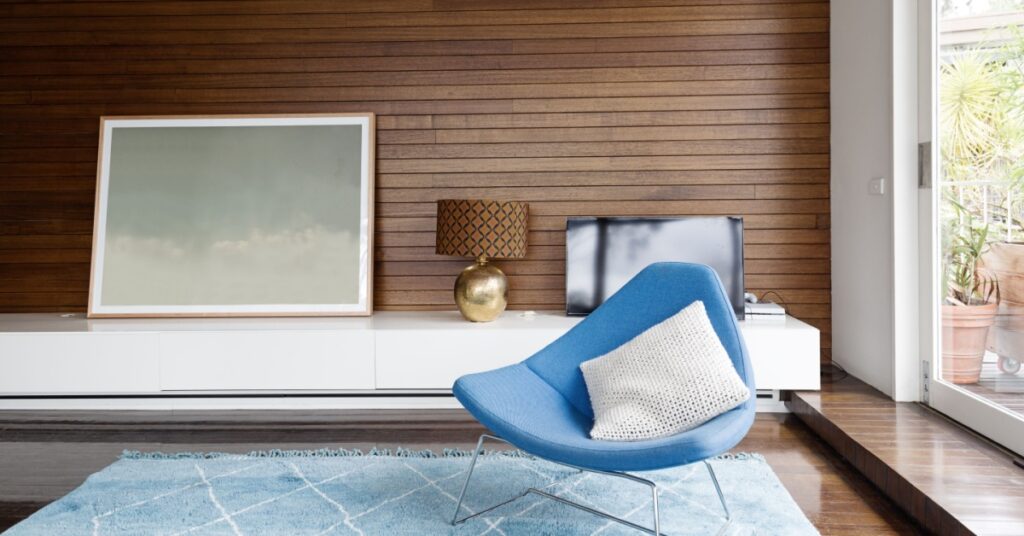 10 Stylish Accent Wall Ideas to Elevate Your Home Design 5 wood paneling on accent wall in room with chair