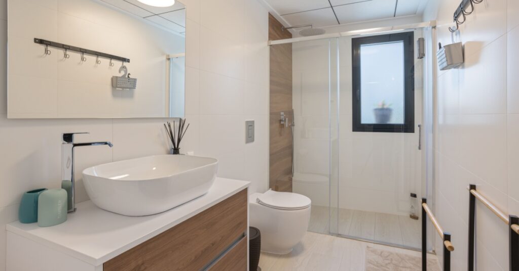 4 Mold-Resistant Paint Options for Bathrooms and Basements 2 bathroom with sink, toilet and shower, concept of mold-resistant paint